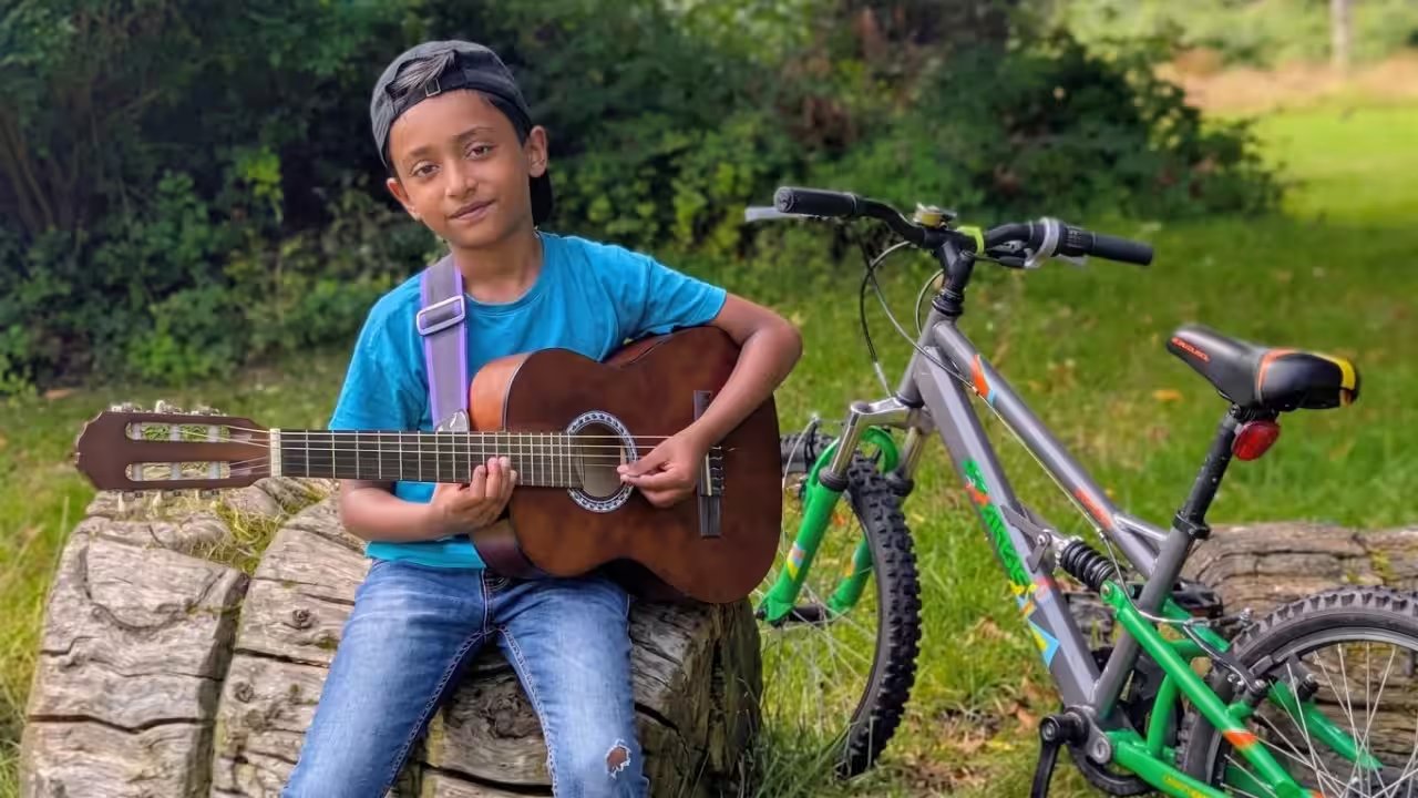 Adrian Abraham, 9, aims to break Guinness record as youngest Grade 8 guitarist
