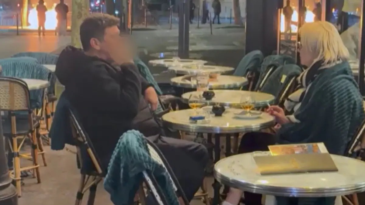 Paris Couple Drinks Calmly as 2,500 Arrests Follow Protest Violence