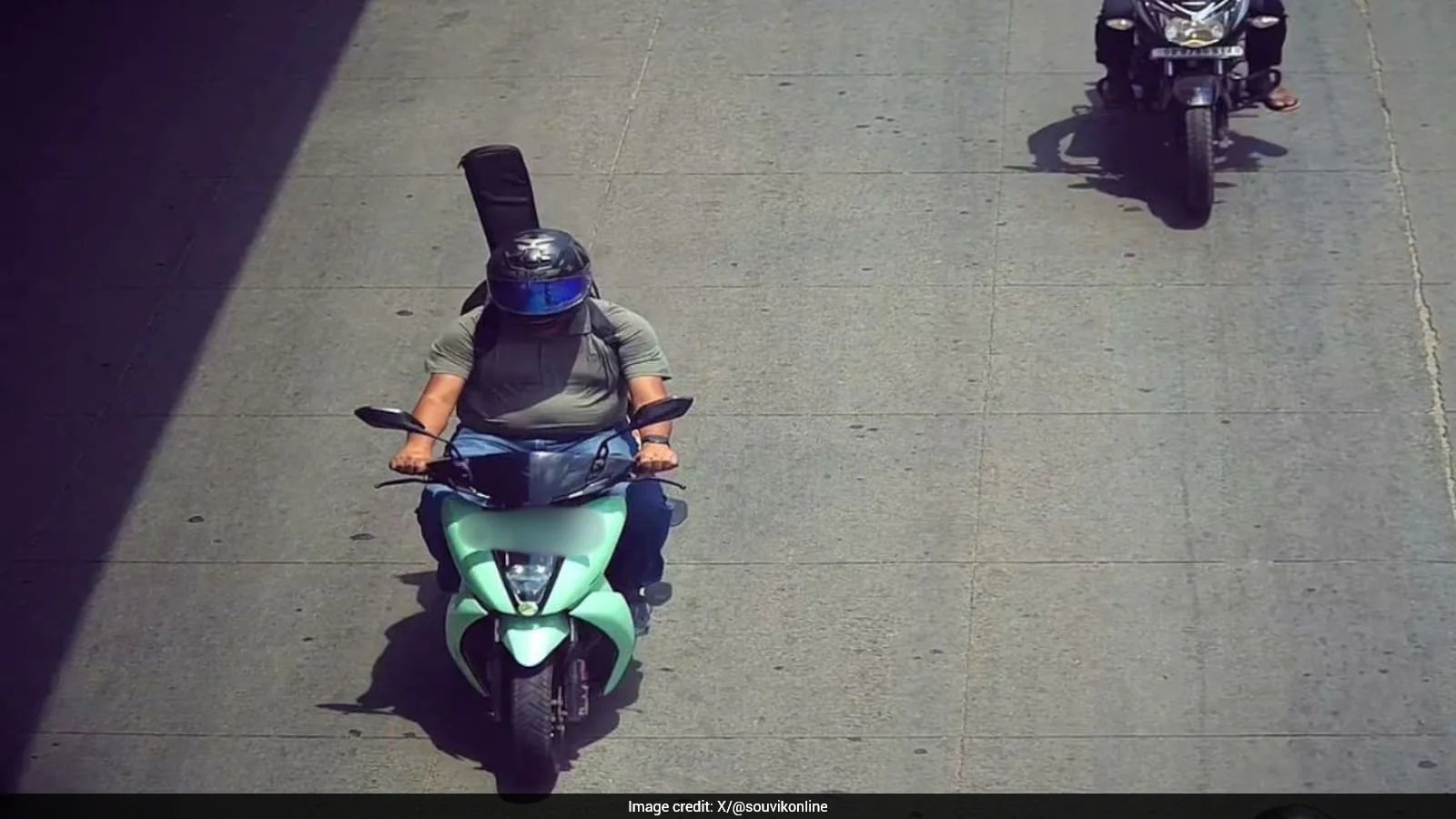 Bengaluru Rider Souvik Dutta Fined Rs 500 After AI Mistakes Guitar For Helmetless Pillion